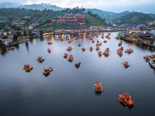 Traditional Chinese-style, tourist boats in dam or lake at Baan, Rak, Thai, Village Mae Hong Son, Thailand.