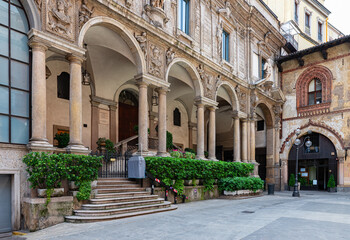 Fototapeta premium View of medieval square Piazza dei Mercanti in Milan, Italy. Cozy cityscape of Milan. Architecture and landmarks of Milan.