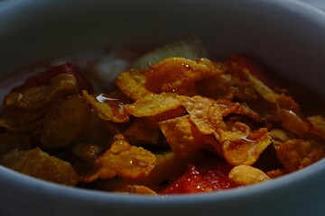 Bowl of Cereal with Fruit and Honey in Morning Light
