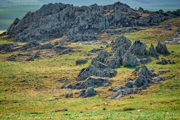 Green shale formations on the surface in the Casimcei Plateau in Romania
