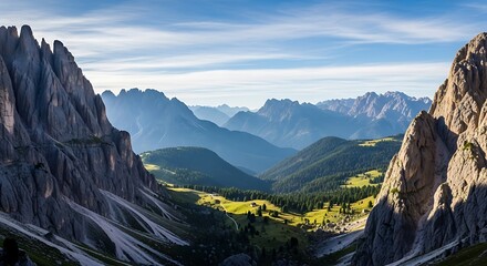 Breathtaking panoramic view of majestic mountain range at sunrise, showcasing the dramatic peaks and lush green valleys under a clear sky