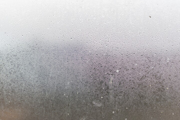 Water droplets condensation background of dew on glass, humidity and foggy blank. Outside, bad...