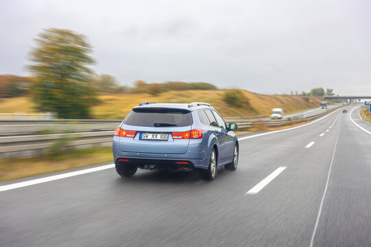 Blue pickup truck in motion. Power and reliability on the road.