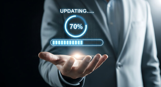 Businessman holding a futuristic progress bar and percentage indicator showing 70% update status