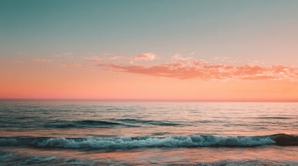 Obraz premium Serene Ocean Sunset at Dusk with Gentle Waves and Tranquil Waters Reflecting Vibrant Colors of a Beautiful Horizon in Soft Pastel Shades