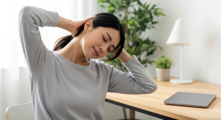 A woman stretching with her arms behind her head and supporting her head.