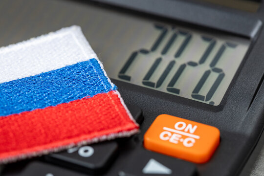 Russia 2026. Financial and business concept. Russian economy. Symbol of the Russian Federation and calculator with the date 2026. Market analysis. Ruble rate. Economic background. Closeup