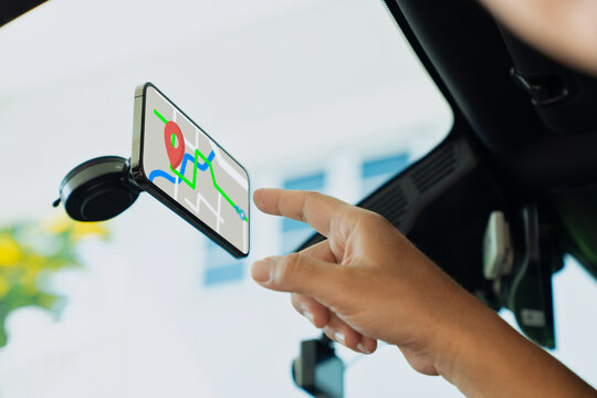 Smartphone mounted in car displaying GPS map and destination