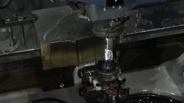 The die insert cutting process by wire EDM machine control by CNC program.