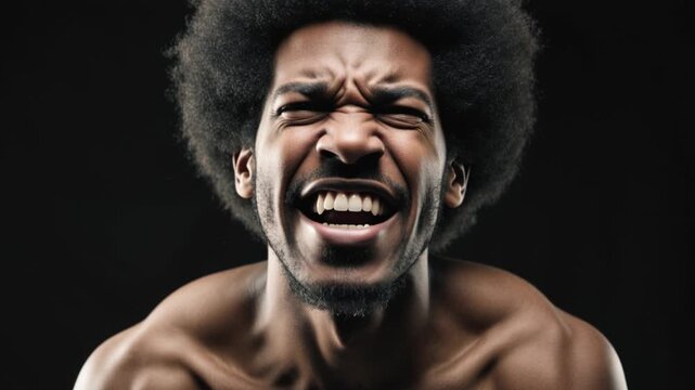 Afro guy screaming on black background. Close Up of a man yelling