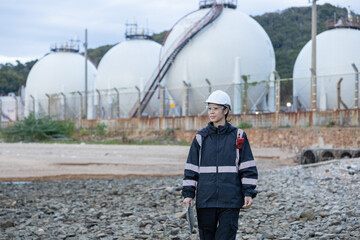 Engineer Monitoring Data at Natural gas plant