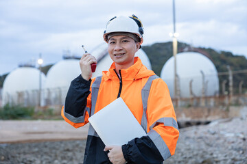 Engineers Conducting Night Inspection at Refinery