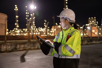 Engineers Conducting Night Inspection at Refinery