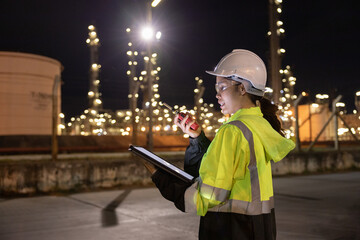 Engineers Conducting Night Inspection at Refinery