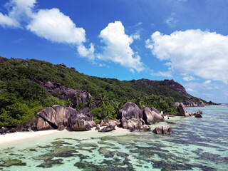 Anse Cocs beach, La Digue Seychelles, tropical beach during a luxury vacation in Seychelles. Tropical beach Anse Cocs beach, La Digue, Praslin, Mahe Seychelles with turqouse colored ocean