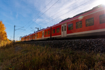 Fototapeta premium German passengers train traveling near Nuremberg on a sunny autumn day
