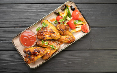 chicken wings grill for family dinners on wooden table.