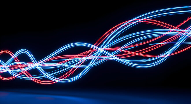 Abstract light trails in blue and red on black background.