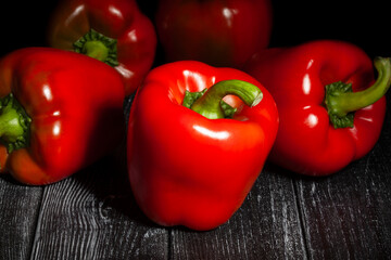 bell pepper on black wood background
