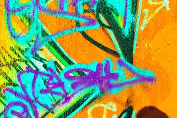 Vibrant graffiti art in neon purple, turquoise, orange. Retro 80s style, bold colors, dynamic patterns. Street art, urban design, digital backgrounds, modern 80s visuals.