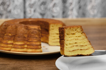 A delicious layered sękacz baked in a cake tin made of sugar and butter, a traditional Christmas cake