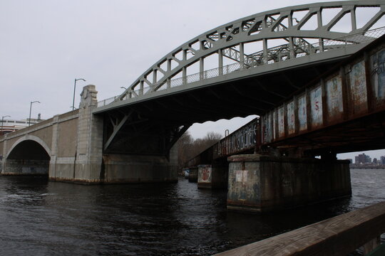 Intersecting Bridges Over a River with Graffiti
