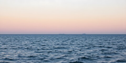 Serene Sunset Over Calm Ocean Waves with Horizon in the Distance