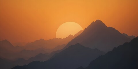 Serene Sunset Over Mountain Range with Vibrant Orange Sky