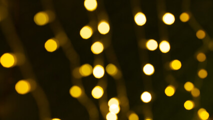 Bright gold sparkles and glowing lights, along with colorful decorations, glitter and bokeh, create a festive, sparkling and fun holiday atmosphere.