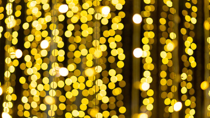 Bright gold sparkles and glowing lights, along with colorful decorations, glitter and bokeh, create a festive, sparkling and fun holiday atmosphere.