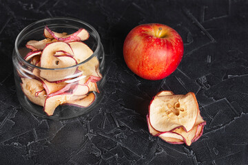 apple and round dried apple chips in a jar