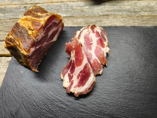 juicy piece of dried meat lies on a cutting board