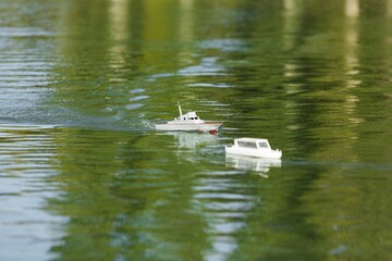 Toy yacht race. Yachting on seascape at sea. Boat spinnaker