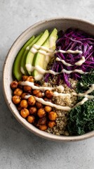 Healthy and Colorful Vegan Buddha Bowl with Quinoa, Chickpeas, Avocado, and Vegetables.