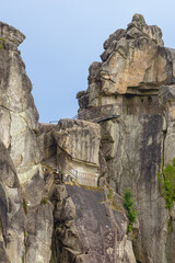 Naklejka premium Stairs winding around the Externsteine, a rock formation in the Teutoburg Forest near Horrn-Bad Meinberg