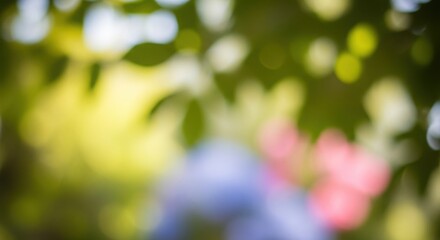 Obraz premium Abstract background with blurred green yellow pink and blue tones creates a dreamy and artistic visual professional stock photography content