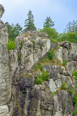 A path with stairs winding around the Externsteine, a rock formation in the Teutoburg Forest near Horrn-Bad Meinberg