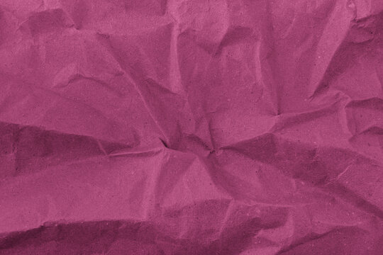 Abstract wrinkled pink crumpled paper texture background