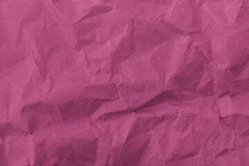 Abstract wrinkled pink crumpled paper texture background