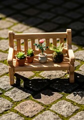 Miniature bench adorned with diverse tiny potted plants in an outdoor setting