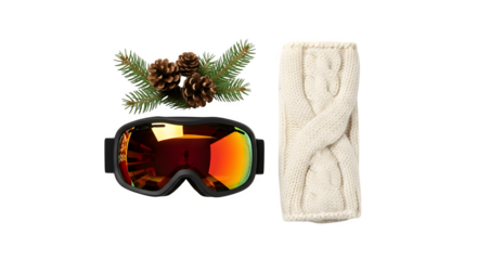 Winter sports gear including ski goggles a pine cone and a rolled up scarf isolated on transparent background