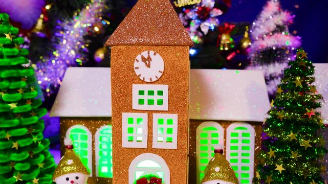 A Christmas town with a chapel surrounded by snowmen and Christmas trees in the center