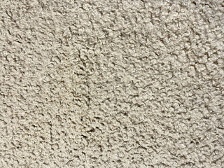 Close up of beige fabric with big pile tufts. Suitable for upholstery and fabric textile. Seamless background texture.