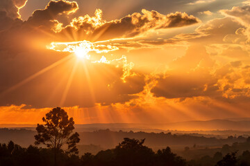 Radiant sunburst in golden clouds at late afternoon