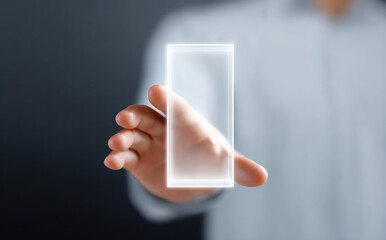 Focused businessman hand holding transparent screen. man presents futuristic technology device concept for business innovation and modern communication