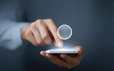 Focused man hand touching glowing icon on smartphone screen. digital user interface for an application with modern technology representing connection and innovation