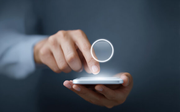 Focused man hand touching glowing icon on smartphone screen. digital user interface for an application with modern technology representing connection and innovation