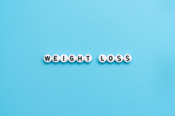 Weight Loss text on light blue background