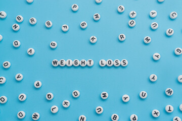 Weight Loss text on light blue background
