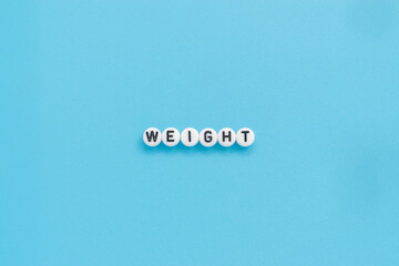 Weight text on light blue background
